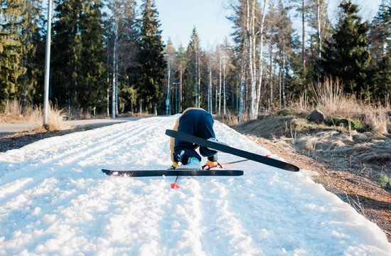 young boy fallen down whilst cross country skiing in Sweden
