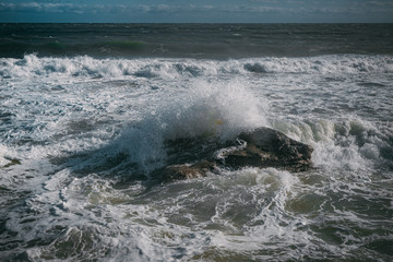 waves on the sea beach on a sunny day