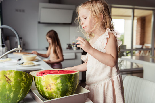 Little girl eating a watermelon