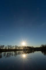 Fototapeta premium Mirror forest lake with reflection in winter sunny day, de Kempen regio in North Brabant, Netherlands