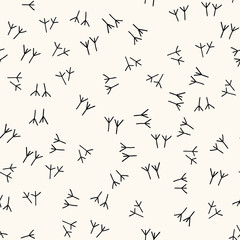 Seamless vector pattern with trace of bird paws, chicken footprints in handdrawn doodle style. Bird steps background