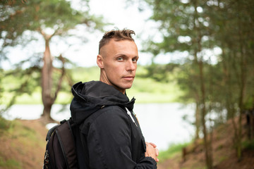 A man in the cold season, in the forest.