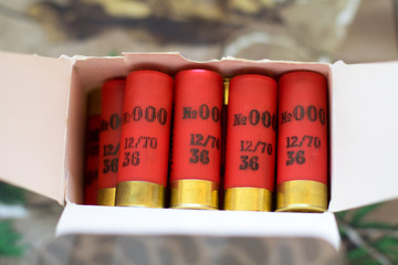 red shotgun cartridgse in the box, 12 gauge, 0000 shot