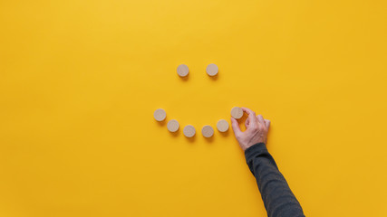 Making a smiling face of blank wooden cut circles