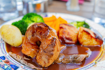 Close up shot of a plate of delicious meat with sauce