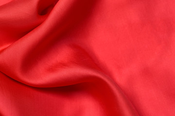 Obraz premium expensive fabric texture. abstract background with soft waves. Smooth elegant red silk or satin luxury cloth