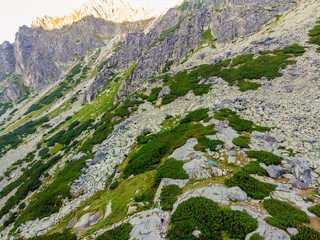 Beautiful waterfall flowing from top of a stone wall. Waterfalll Skok. Mlynicka valley with stone hiking trail. High Tatras mountains in Slovakia © Zedspider