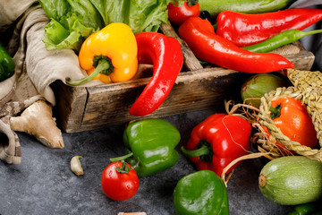 Chili peppers in a rustic wooden tray.