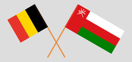 Crossed flags of Oman and Belgium