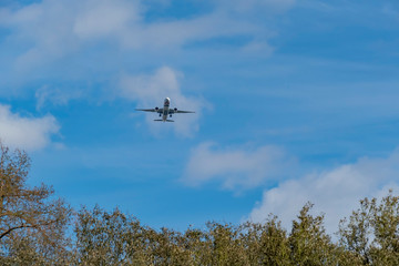Fototapeta na wymiar Airplane flying with a beautiful background