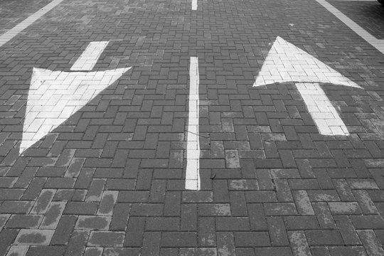 Arrows sign on the road. Both sides sign. Up and Down arrows.
