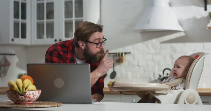 Father trying to work at home
