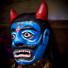 traditional Indian face mask worn by a folk performer