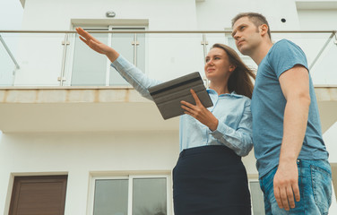 Real estate agent shows the development to his client.