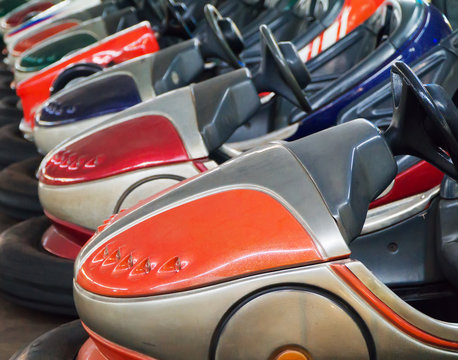 Bumper cars in the city amusement park at evening.