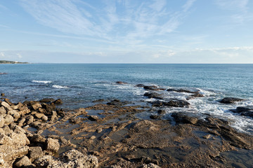 Fototapeta na wymiar Stones in the surf of the Mediterranean Sea