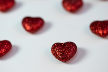 red shiny hearts on a white background. Postcard. Romantic background. Valentine's day. Mother's day.