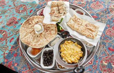 Тraditional turkish breakfast-cheese cakе, meat cake,omelet, cheese, vegetables, olives