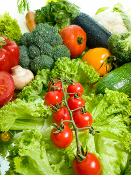 Macro image of broccoli, myshrooms, tomato, pepeer and salad leaves on kitchen. Concept of healthy food and nutrition