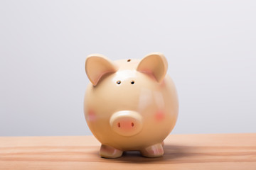  Piggy bank on wooden table