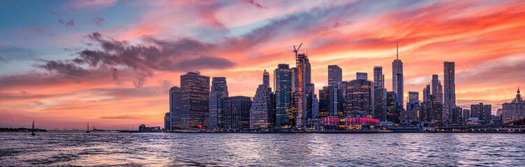 new york city skyline travel destination at dramatic sunset over manhatten