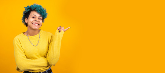 young girl or brunette woman with blue curls isolated on yellow background