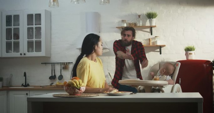 Parents with baby having argument