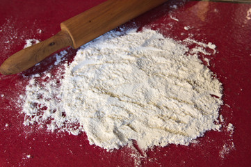 A table with flour and a rolling pin leave room for texts or graphics