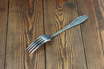Melchior fork on a wooden background