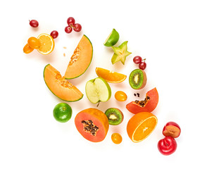 Fruits healthy food summer color layout. Papaya, orange, kiwi, melon isolated on white. Detox fruity health vitamin diet creative concept. Colorful fresh raw fruit tropical background, top view.