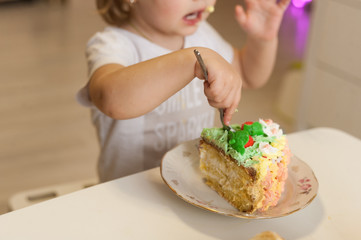 baby eating cake