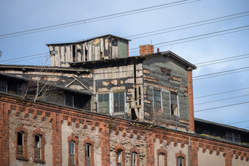 Lost place, abandoned dilapidated brick building in the old cargo port of Luebeck, Germany