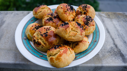 A plate of typical Turkish oven product pastry as known pogaca. Close up of traditional Turkish...