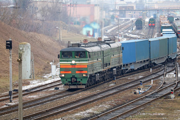 Fototapeta na wymiar freight locomotive passes the railway station