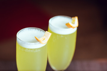 glasses of sour pisco, with orange lemon and foam