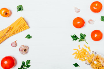 Food background of spaghetti and fusilli pasta