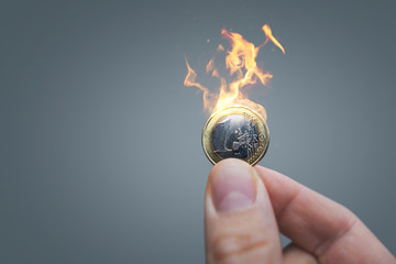 Euro coin on fire