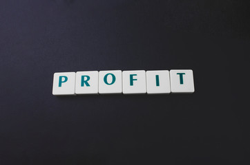 Single word - profit on the black background with copy space. Element for banner