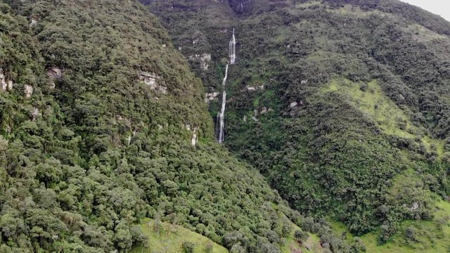 mountain waterfall, aerial drone shot in Colombia, magical, La chorrera Waterfall