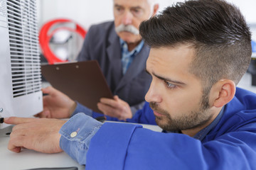 man checking printer problem