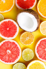 Summer vibes. Tropical background, citrus texture on yellow background. Summertime vacation, cocktail, tropical beach. Creative fruity layout