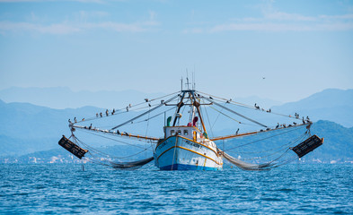 Fototapeta na wymiar Shrimp fishing boat, Rincon de Guayabitos, Compostela municipality, Pacific Ocean, Riviera Nayarit, Nayarit State, Mexico, Central America, America