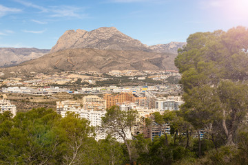 Obraz premium Natural park and residential complex on the background of Mount Puig Campana in La Cala de Fenistrat, Benidorm, Spain