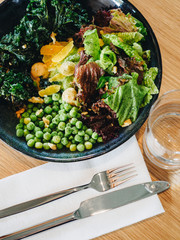 Fresh vegan vegetable salad on the table in bistro
