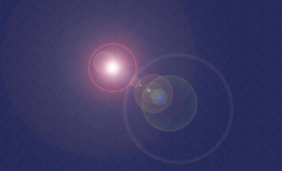 Lens flare on textured dark blue background