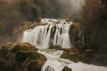Beautiful waterfall Cascada delle Marmore in Terni, Italy. Landscape photo. Waterfall in green forest.