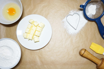 Fototapeta na wymiar Ingredients for baking cake - flour, egg, butter.
