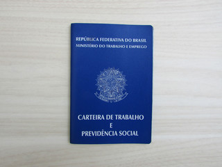 Brazilian paper of work and social security (Carteira de trabalho) on light wood