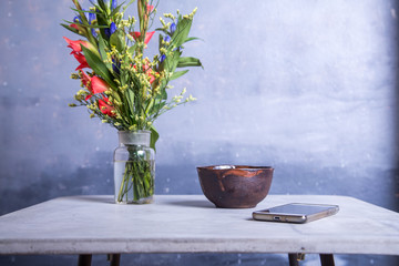Workplace in blues and grays with flower and a cup in the coffee shop
