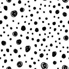 Dot doodles seamless pattern. Hand drawn circles texture background.
